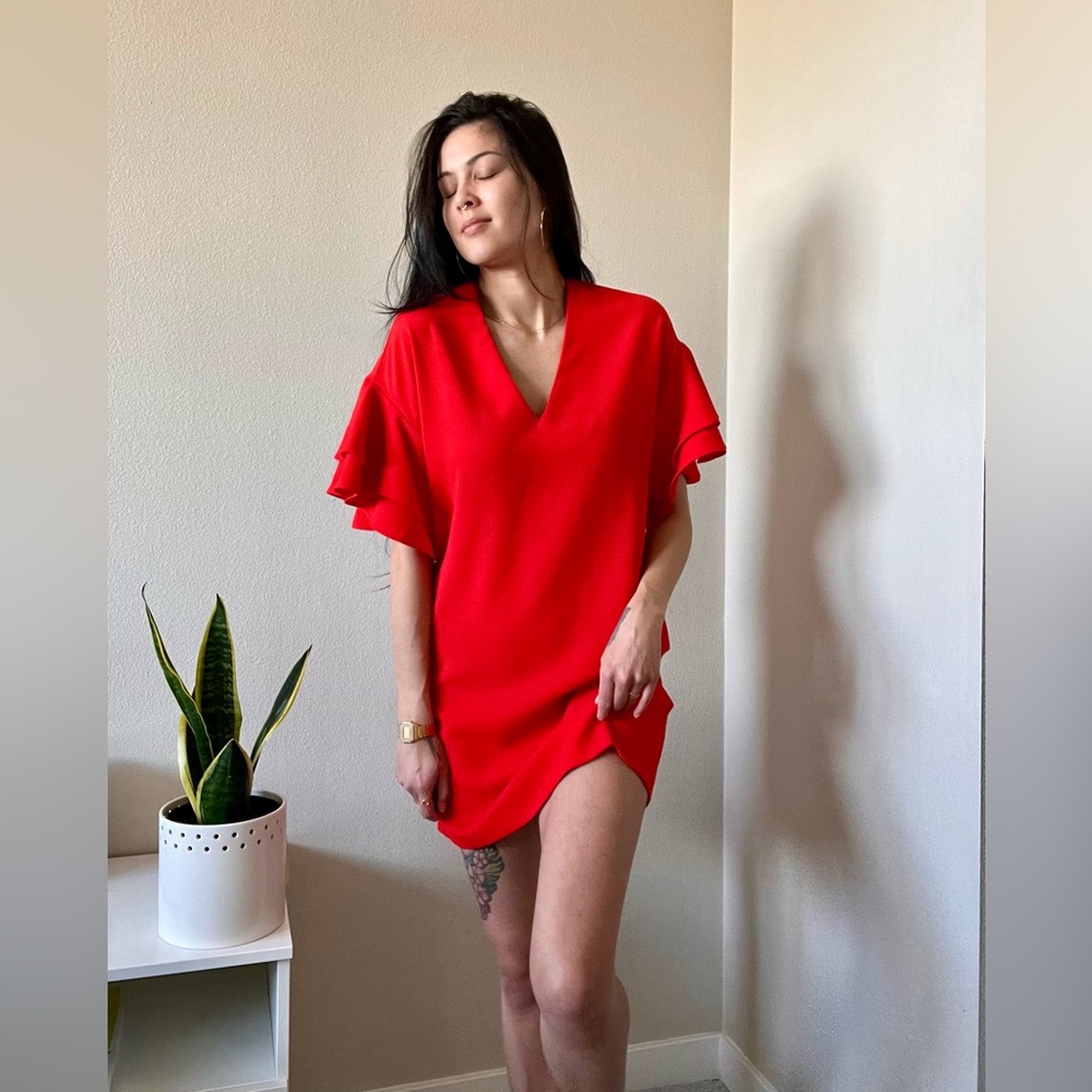 Short red dress with ruffled sleeves